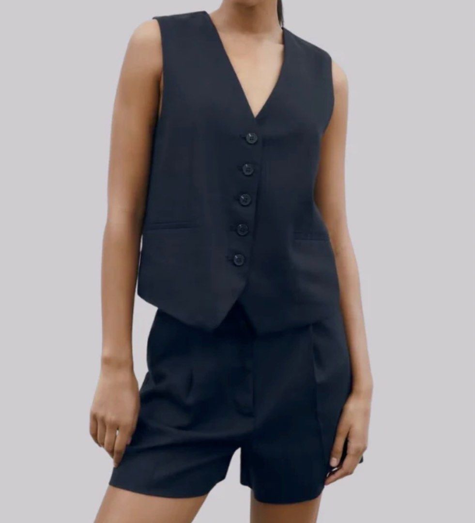 Overstacked Black Vest - Size S (Category: Sleeveless) located in Makati City. Submitted by harekrisha (Listing ID 1416785048, Image 1). Description: Overstacked black vest made from thick yet breathable material. Selling because it’s a bit big for me in the armhole part even if it’s in size Small..
