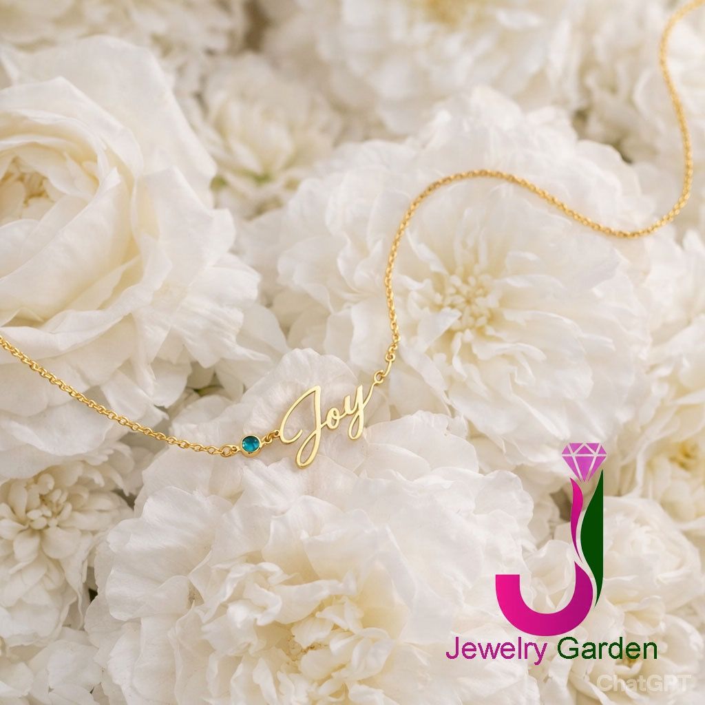 Personalized Gold Name Necklace with Birthstone (Category: Necklaces) located in Manila. Submitted by jewelrygardens (Listing ID 1422084315, Image 1). Description: - Gold necklace with name pendant. - Features a small birthstone. - Delicate, fine-link chain. - Designed to sit gracefully on the neckline. - Ideal personalized accessory or gift..