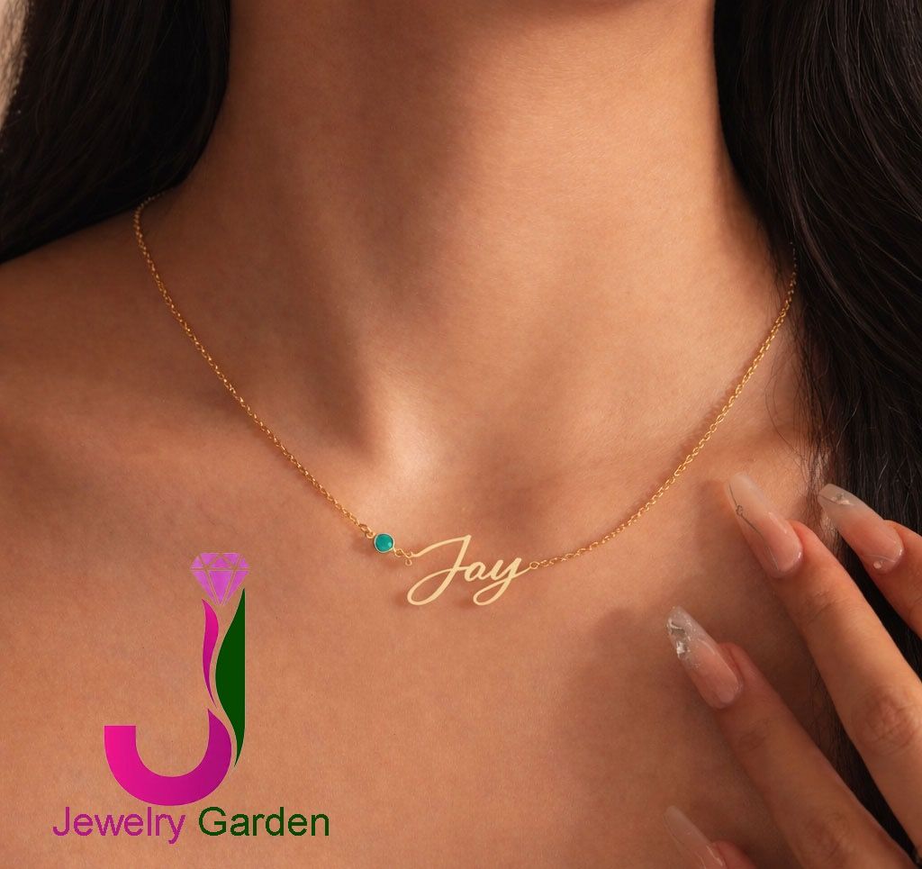 Personalized Gold Name Necklace with Birthstone (Category: Necklaces) located in Manila. Submitted by jewelrygardens (Listing ID 1422084315, Image 2). Description: - Gold necklace with name pendant. - Features a small birthstone. - Delicate, fine-link chain. - Designed to sit gracefully on the neckline. - Ideal personalized accessory or gift..