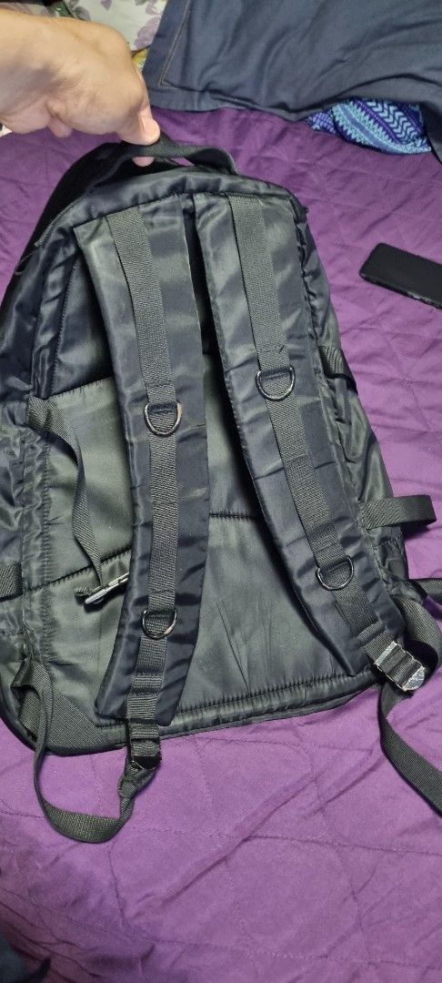 Porter-Yoshida & Co. Black Backpack (Category: Backpacks) located in Manila. Submitted by myno23lenel (Listing ID 1422086975, Image 3). Description: - Black Porter-Yoshida & Co. backpack - Multiple compartments for storage - Interior pocket with orange lining - Adjustable straps for a comfortable fit - Top handle for easy carrying - Features a small logo patch - "Made in Japan" label -Good Condition,signs of usage -Location Fairview.