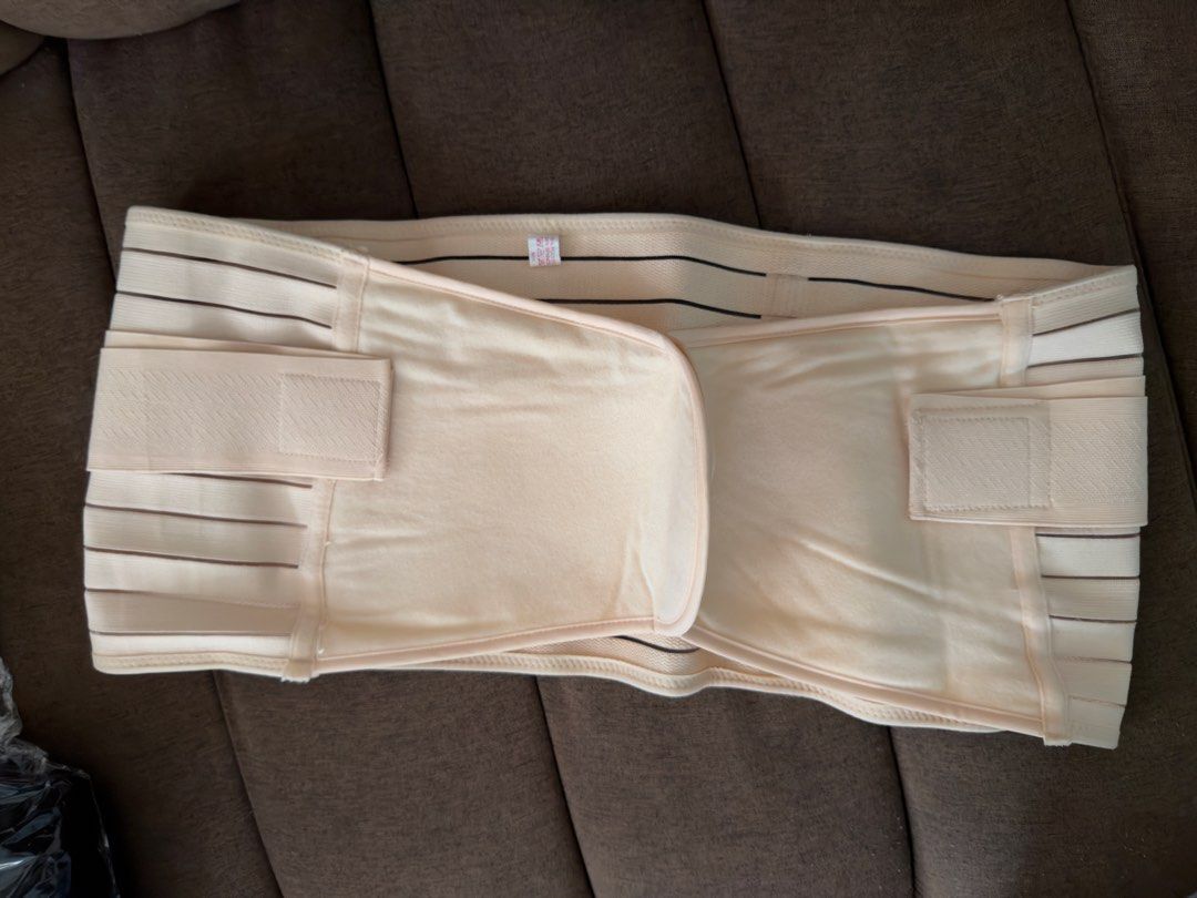 Postpartum Belly Wrap Beige (Category: Maternity Care) located in Quezon City. Submitted by araezekiel (Listing ID 1422159379, Image 2). Description: - Beige postpartum belly wrap - Designed for abdominal support after delivery - Adjustable straps for a comfortable fit - Made with soft, breathable material - Multiple panels and closures for a secure fit - Helps with postpartum recovery Too big for me. Only used twice XXL.