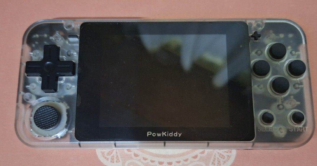 Powkiddy Q90 Handheld Game Console (Category: Others) located in Las Pinas. Submitted by bubblybeer15 (Listing ID 1422151581, Image 1). Description: - Powkiddy Q90 handheld console - Preloaded with Super Mario Advance - Clear transparent design - Features D-pad, analog stick, and action buttons - Screen displays game menu - In good working condition - may LCD lines lang sa right side.