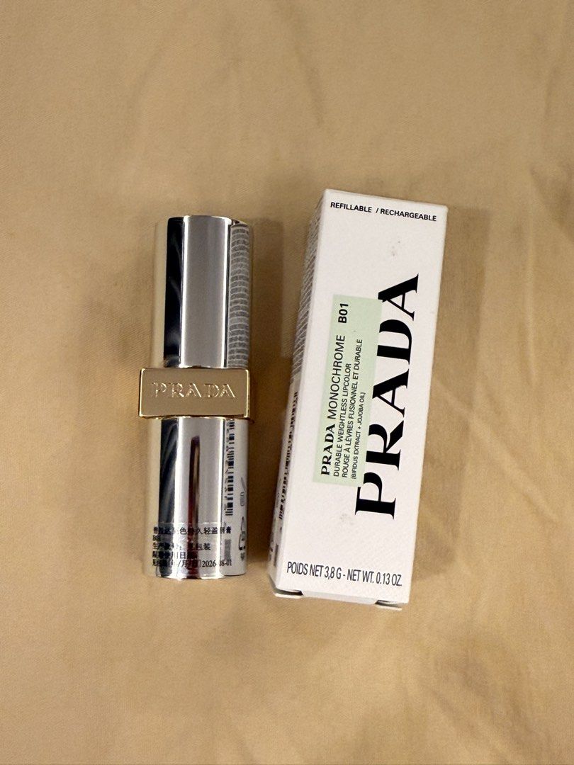Prada Monochrome Lipstick B01 (Category: Makeup) located in Lucena. Submitted by fashioncult.ph (Listing ID 1422097466, Image 1). Description: - Prada Monochrome Lipstick in B01 shade - Long-lasting, weightless formula - Refillable design - Net weight: 3.8g / 0.13 oz - Luxurious silver and gold-toned case SRP is 2950.