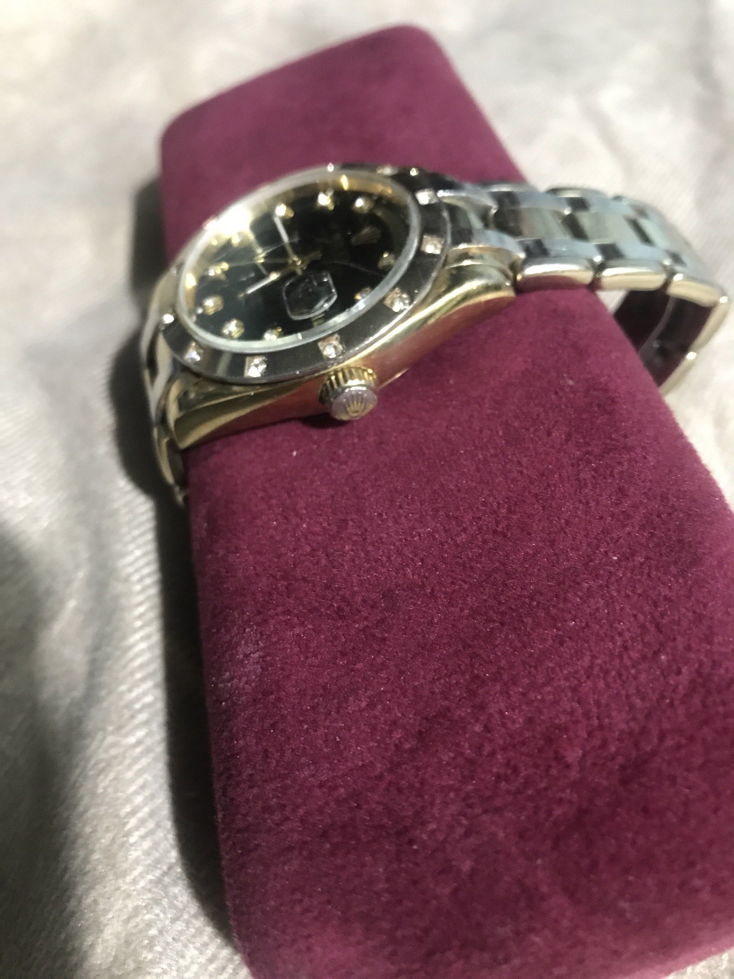 Rolex Day-Date Watch with Diamond Markers (Category: Luxury Watches) located in Baguio. Submitted by agozun61 (Listing ID 1422162603, Image 3). Description: - Rolex Day-Date watch - Black dial with diamond hour markers - Gold and silver-tone bracelet - Day and date display - Fluted bezel - In good working condition.
