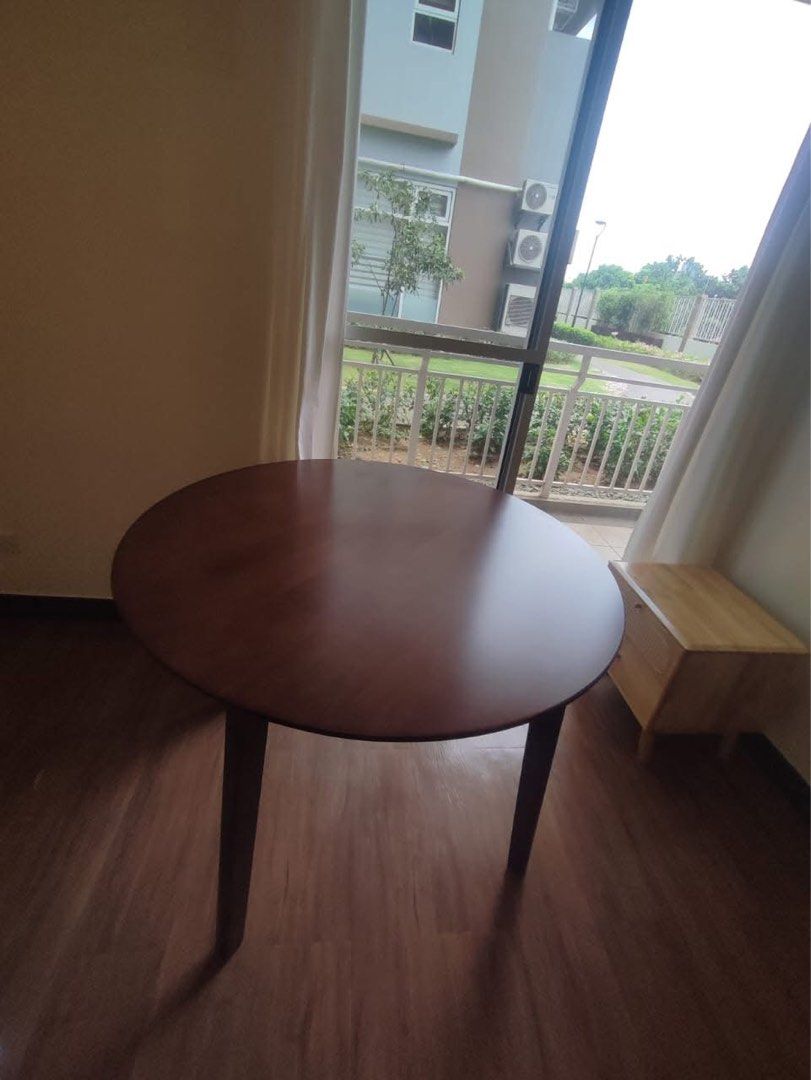 Round Dining Table (Category: Tables & Sets) located in Quezon City. Submitted by furniturefinds888 (Listing ID 1422182017, Image 3). Description: - Round dining table with 4 chairs - Dark wood table finish - Black chair seats - Modern design - Ideal for apartments and small dining areas - Stylish and comfortable.