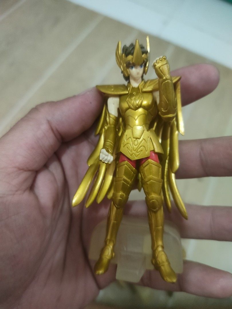 Saint Seiya Action Figures (Category: Figurines & Statues) located in Plaridel. Submitted by klayskolektibols (Listing ID 1422169596, Image 2). Description: - Saint Seiya action figures - Golden armor - Unique hair colors - Some figures with weapons - Includes clear display base - Ideal for collectors and fans.