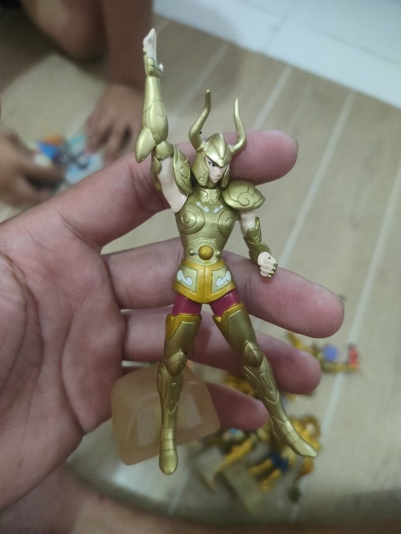 Saint Seiya Action Figures (Category: Figurines & Statues) located in Plaridel. Submitted by klayskolektibols (Listing ID 1422169596, Image 3). Description: - Saint Seiya action figures - Golden armor - Unique hair colors - Some figures with weapons - Includes clear display base - Ideal for collectors and fans.