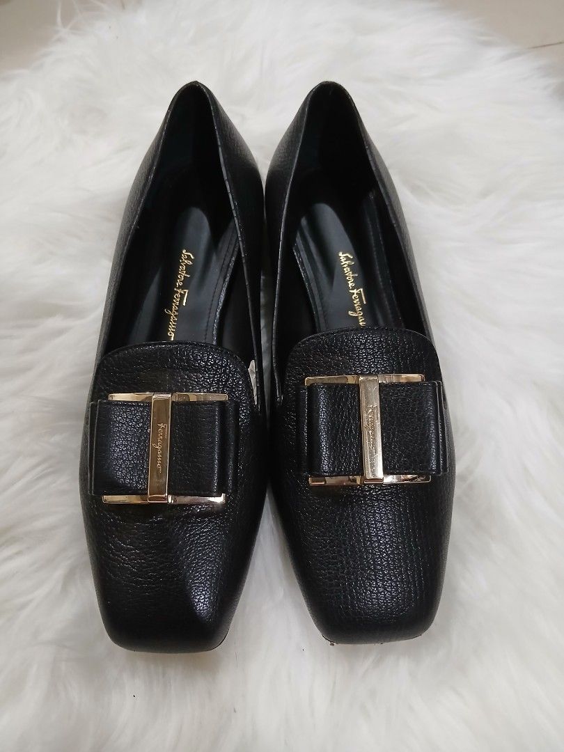 Salvatore Ferragamo Black Leather Flats (Category: Flats & Sandals) located in Antipolo. Submitted by loveluxurydiscount (Listing ID 1422160435, Image 1). Description: - Salvatore Ferragamo flats - Black leather - Square toe design - Gold-tone buckle detail - Low heel - Brand logo on insole - Shows some wear on soles - Sophisticated style.