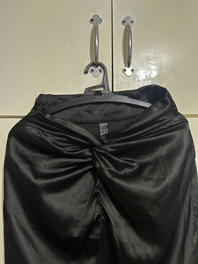 SHEIN Black Satin Skirt (Category: Skirts) located in Taytay. Submitted by jasfinds_ (Listing ID 1422166763, Image 3). Description: - SHEIN black satin midi skirt - Knot detail at waist - Good condition.