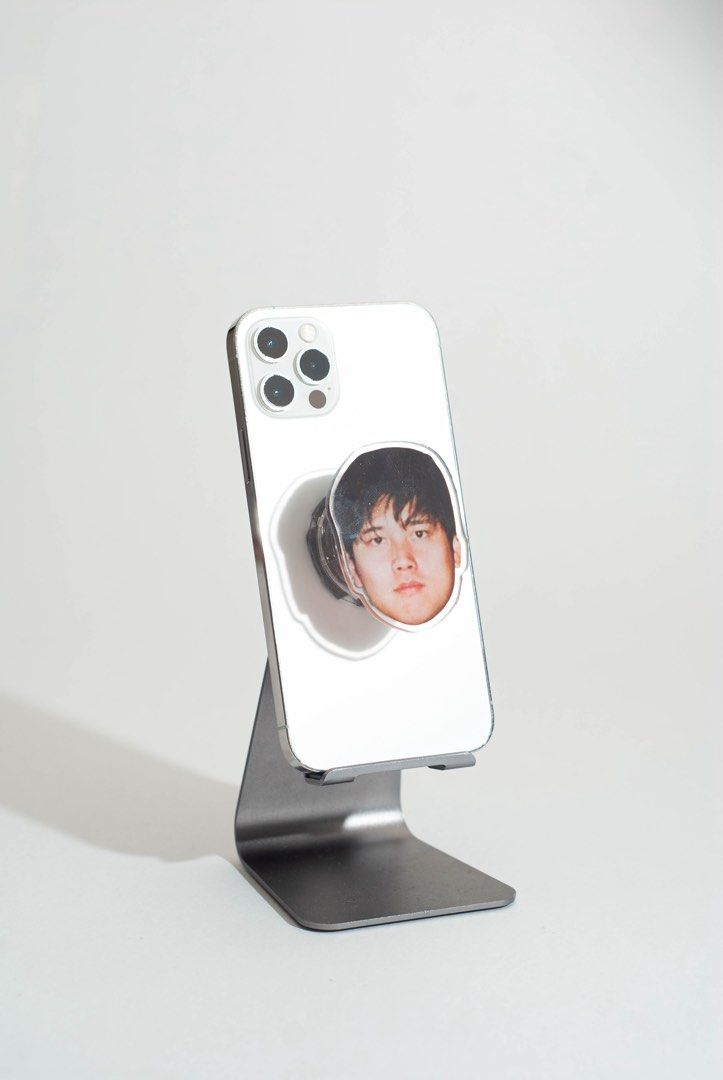Shohei Ohtani Griptok / Popsocket (Category: Mounts & Holders) located in Quezon City. Submitted by savespaces (Listing ID 1422183788, Image 1). Description: Customized Shohei Ohtani popsockets • brand new, with protective plastics on both sides of Shohei’s face • 2 left • comes with the “airbag” hahaha • material: clear acrylic • can double as phone stand for whenever you’re binge watching Can send more photos thru chat!.