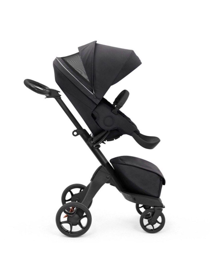 Stokke Xplory Stroller - Black (Category: Strollers) located in Taguig. Submitted by jehana_sangkula (Listing ID 1422159056, Image 2). Description: Stokke Xplory stroller features a sleek black design. It has a height-adjustable seat and a large canopy for sun protection. The stroller includes a storage bag and a comfortable seat for the child..