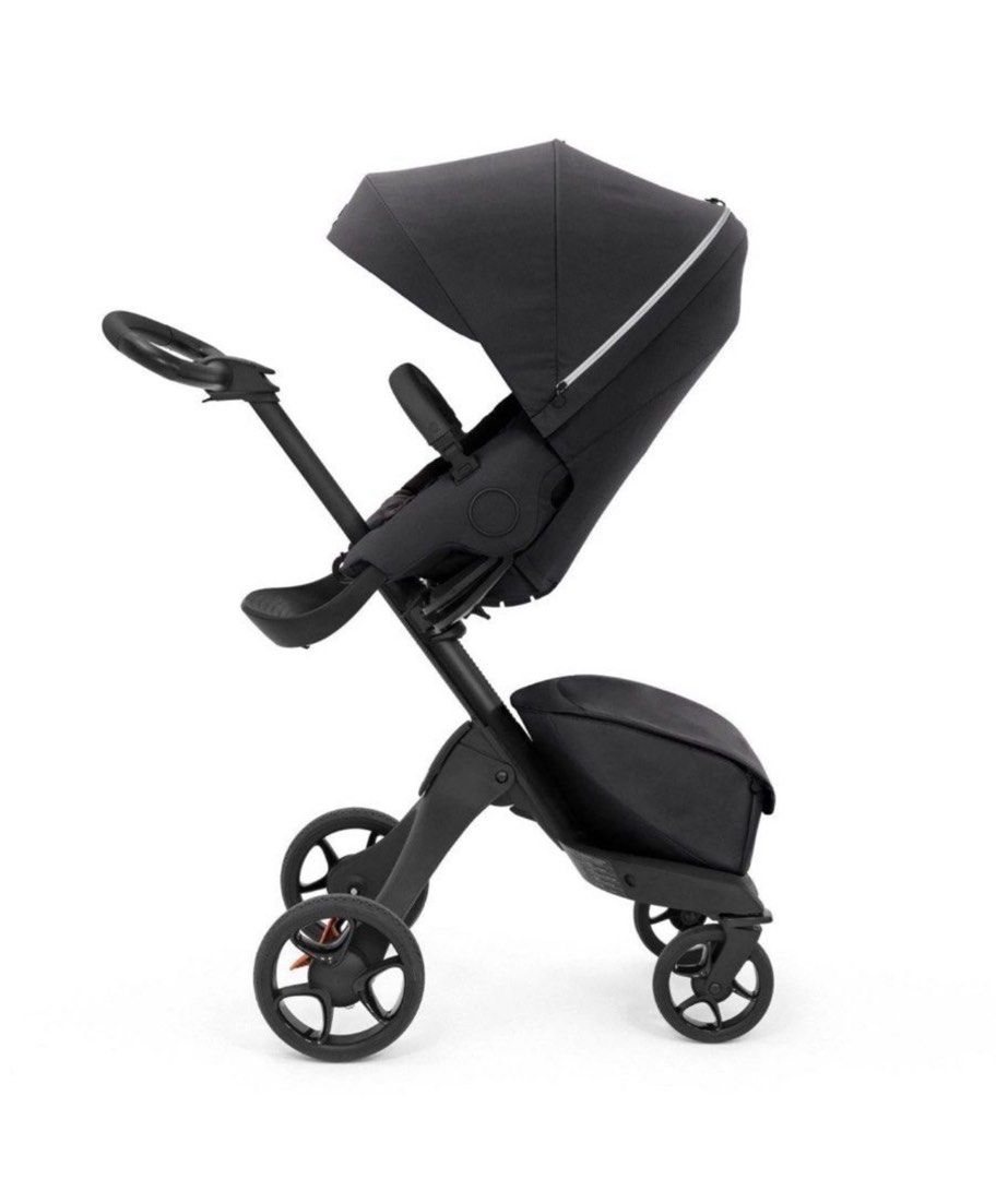 Stokke Xplory Stroller - Black (Category: Strollers) located in Taguig. Submitted by jehana_sangkula (Listing ID 1422159056, Image 1). Description: Stokke Xplory stroller features a sleek black design. It has a height-adjustable seat and a large canopy for sun protection. The stroller includes a storage bag and a comfortable seat for the child..
