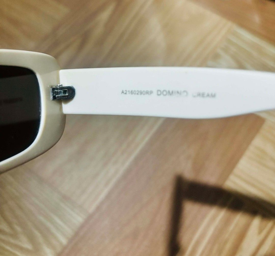 Sunnies Studios Domino Cream Sunglasses (Category: Sunglasses & Eyewear) located in San Jose del Monte. Submitted by verniy (Listing ID 1422213274, Image 2). Description: These sunglasses feature a cream-colored frame with dark lenses. The model is Domino Cream. The frame has the code A2160290RP. The size is 58-32 1N. These sunglasses are a stylish accessory for everyday wear..