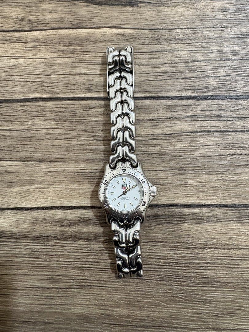 Tag Heuer Professional 200m Watch (Category: Luxury Watches) located in Manila. Submitted by kr_fashion_hub (Listing ID 1422116163, Image 2). Description: - Tag Heuer Professional 200m watch - White dial - Stainless steel band and case - Clasp markings: "TAG HEUER" and "ALL STAINLESS STEEL" - Back markings: "TAG HEUER", "200 METERS TESTED", and "SWISS MADE".