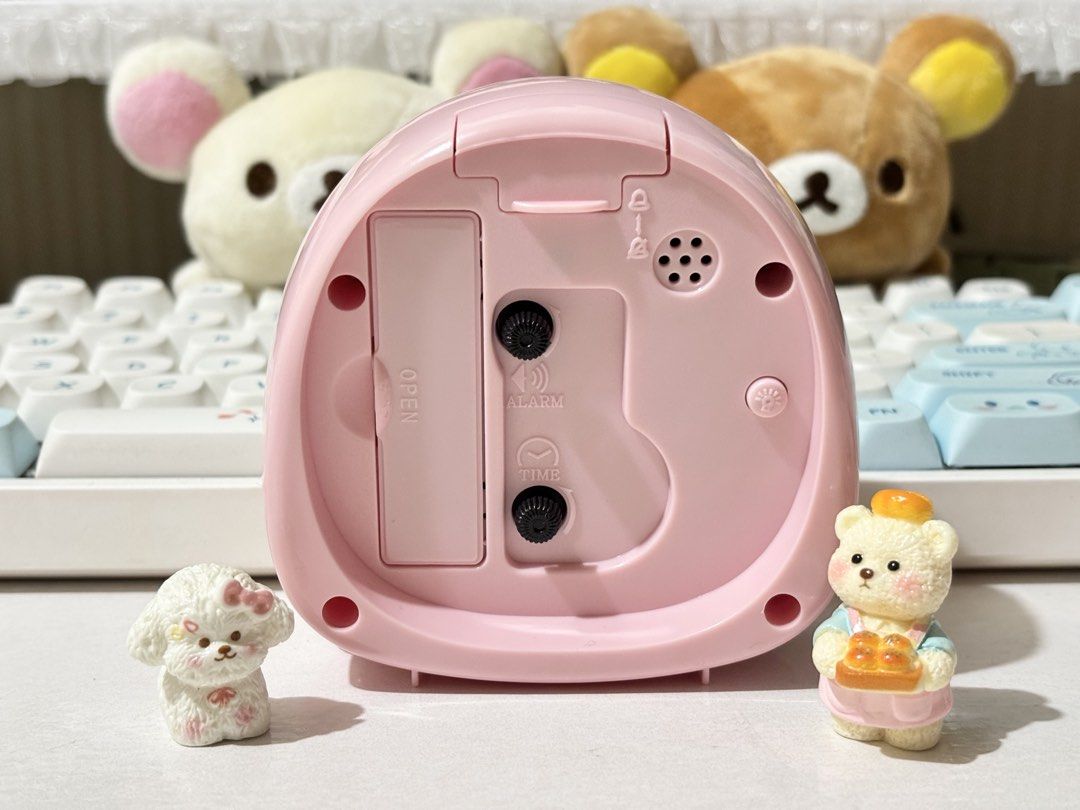 Taro Chans Alarm Clock (Category: Clocks) located in Quezon City. Submitted by ms.cherrylatte (Listing ID 1422222987, Image 3). Description: - Pink Taro Chans Komarana alarm clock - Features a cute bear design - Includes light function - Alarm and time controls on the back - Comes with original box - Perfect for bedroom decor or as a gift.