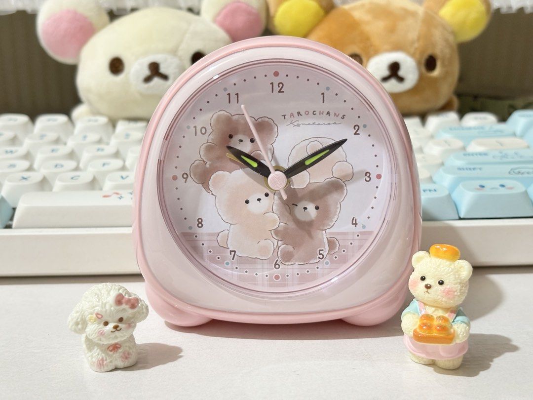 Taro Chans Alarm Clock (Category: Clocks) located in Quezon City. Submitted by ms.cherrylatte (Listing ID 1422222987, Image 2). Description: - Pink Taro Chans Komarana alarm clock - Features a cute bear design - Includes light function - Alarm and time controls on the back - Comes with original box - Perfect for bedroom decor or as a gift.
