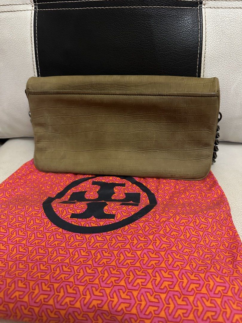 Tory Burch Croc-Embossed Chain Bag (Category: Luxury Bags & Wallets) located in Makati City. Submitted by mosaicph (Listing ID 1422152177, Image 2). Description: Tory Burch handbag features a croc-embossed design with a chain strap. It has a large Tory Burch logo on the front. The bag includes a dust bag. The interior has a zippered pocket. The color is a muted olive green. The bag has a flap closure..