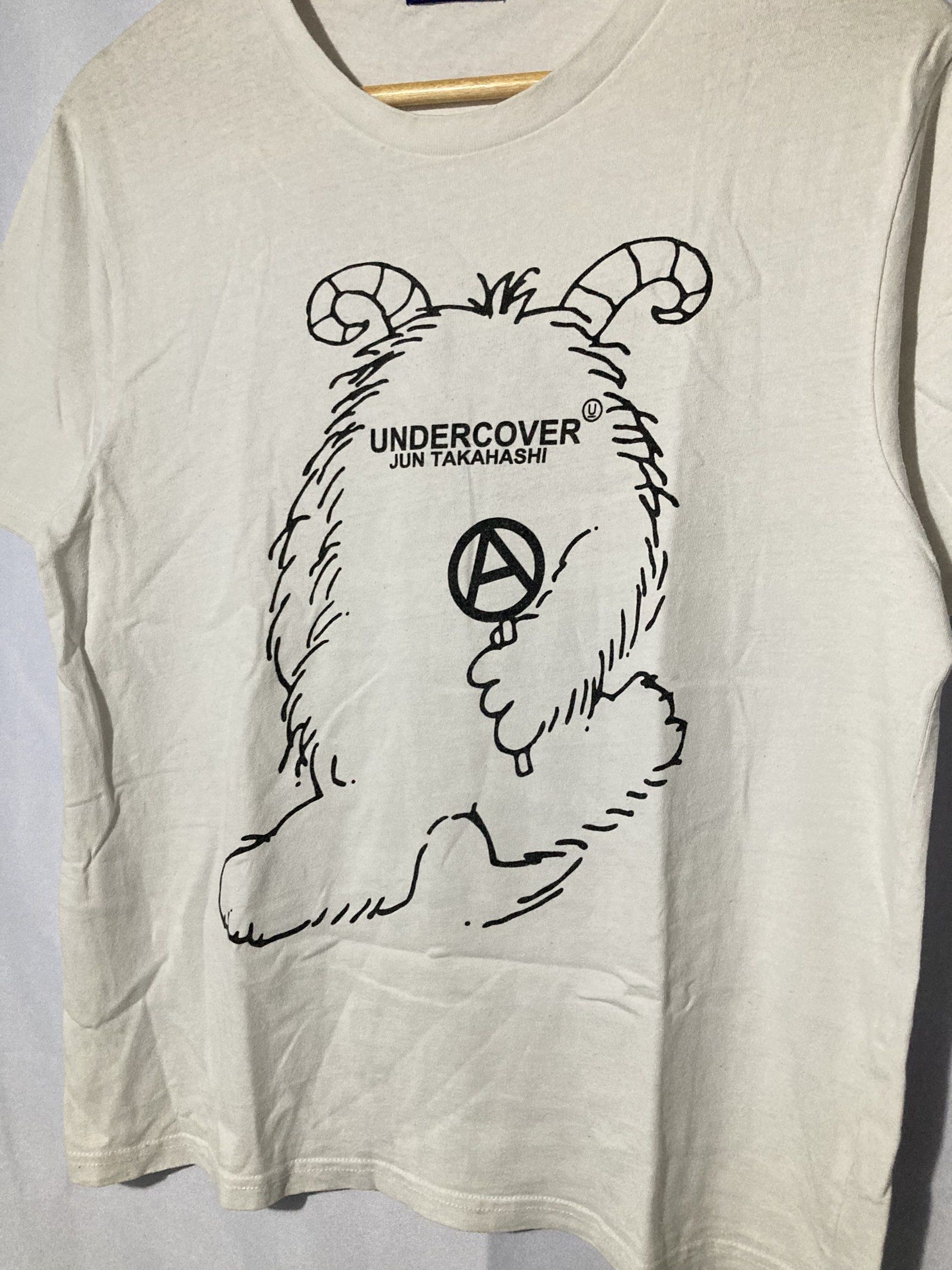 UNDERCOVER JUN TAKASHI ANARCHY MONSTER SHIRT (Category: Luxury Apparel) located in Naga. Submitted by wwy3ips (Listing ID 1411261259, Image 2). Description: UNDERCOVER JUN TAKASHI ANARCHY MONSTER TSHIRT SIZE 3 ON TAG 19 WIDTH 26 LENGTH IN VERYGOOD CONDITION 9/10 COLOR RATE NO ISSUE .
