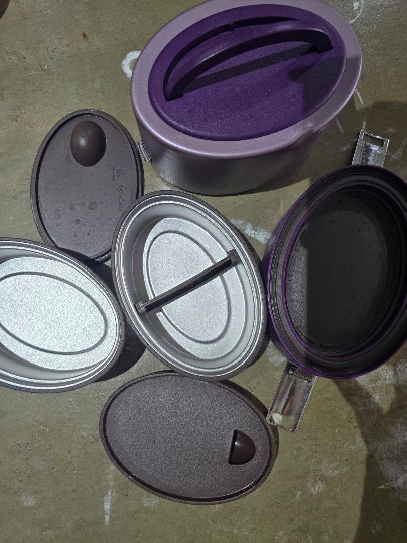 Vaya Tyffyn Lunchbox (Category: Food Organization & Storage) located in Caloocan City. Submitted by phyllis4 (Listing ID 1422083179, Image 1). Description: - Vaya Tyffyn lunchbox with a stylish purple and pink design. - Includes multiple containers and lids. - Designed to keep food warm or cold. - Features the Vaya logo. - Convenient handle for easy portability..