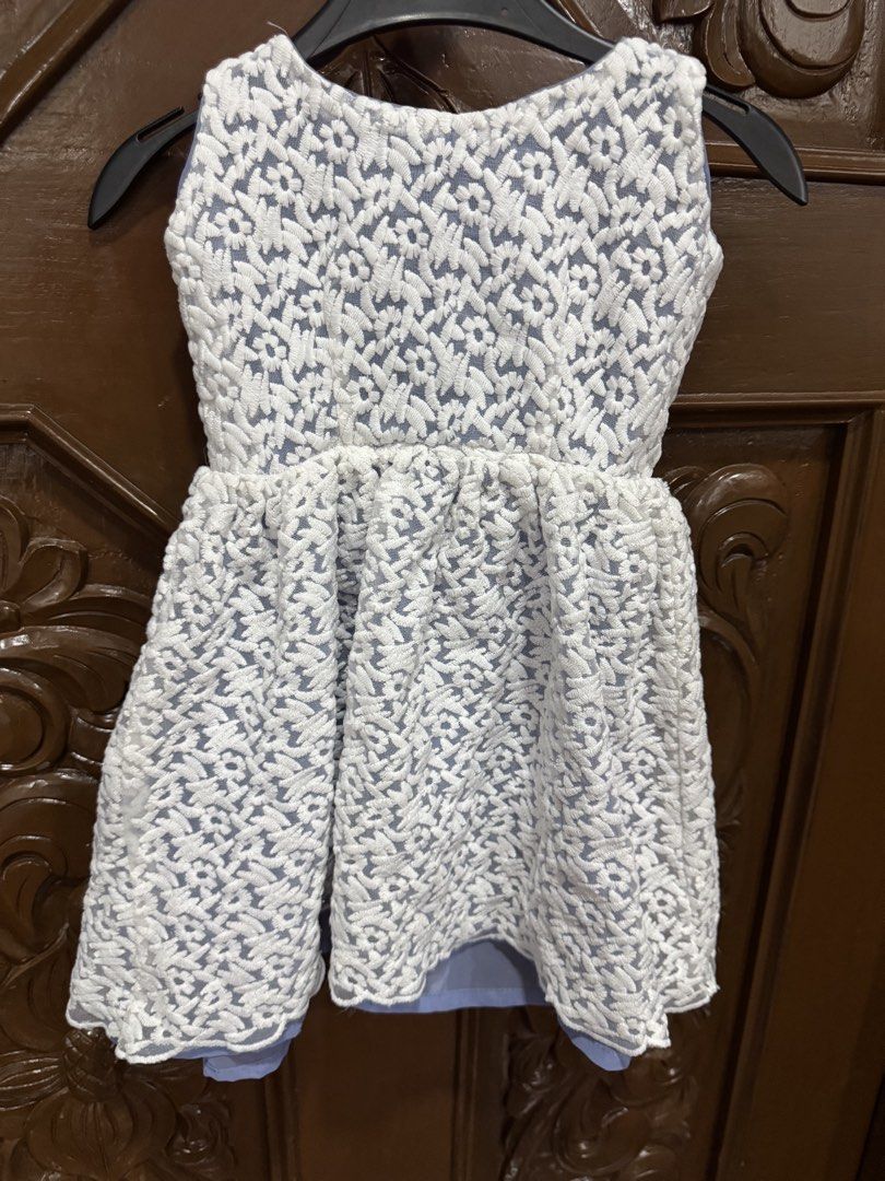White Lace Dress (Category: Babies & Kids Fashion) located in Manila. Submitted by crazycat13 (Listing ID 1422084971, Image 1). Description: - White lace dress - Sleeveless design - Delicate floral pattern - Light blue lining - Fitted bodice - Flared skirt - Zipper closure at the back Worn only once.