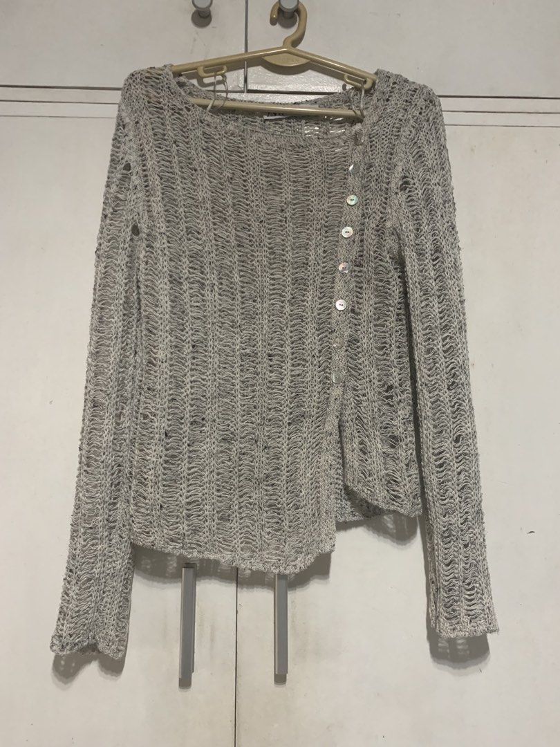 Zara Asymmetrical Knit Cardigan (Category: Coats, Jackets and Outerwear) located in Manila. Submitted by c980_ (Listing ID 1422120819, Image 3). Description: - Zara knit cardigan - Asymmetrical design - Button-up front - Textured, open-knit weave - Long sleeves - Scoop neckline - Light gray with flecks - Size: EUR S, USA S, MEX 26 - Made in Bangladesh - Used once, no flaws - No when worn pics.
