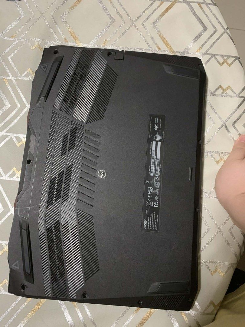 Acer Nitro 5 Gaming Laptop (Category: Laptops & Notebooks) located in Caloocan City. Submitted by johnmagbits-45063 (Listing ID 1422327810, Image 3). Description: - Acer Nitro 5 gaming laptop - Red backlit keyboard - Multiple ports: HDMI, USB, USB-C - Sleek black finish - Custom wallpaper - AMD Ryzen sticker - Cooling vents on the bottom RFS: May PC nako and di ko need masyado ng laptop I only used this during my IT days. Acer Nitro 5 AN515-45-R7