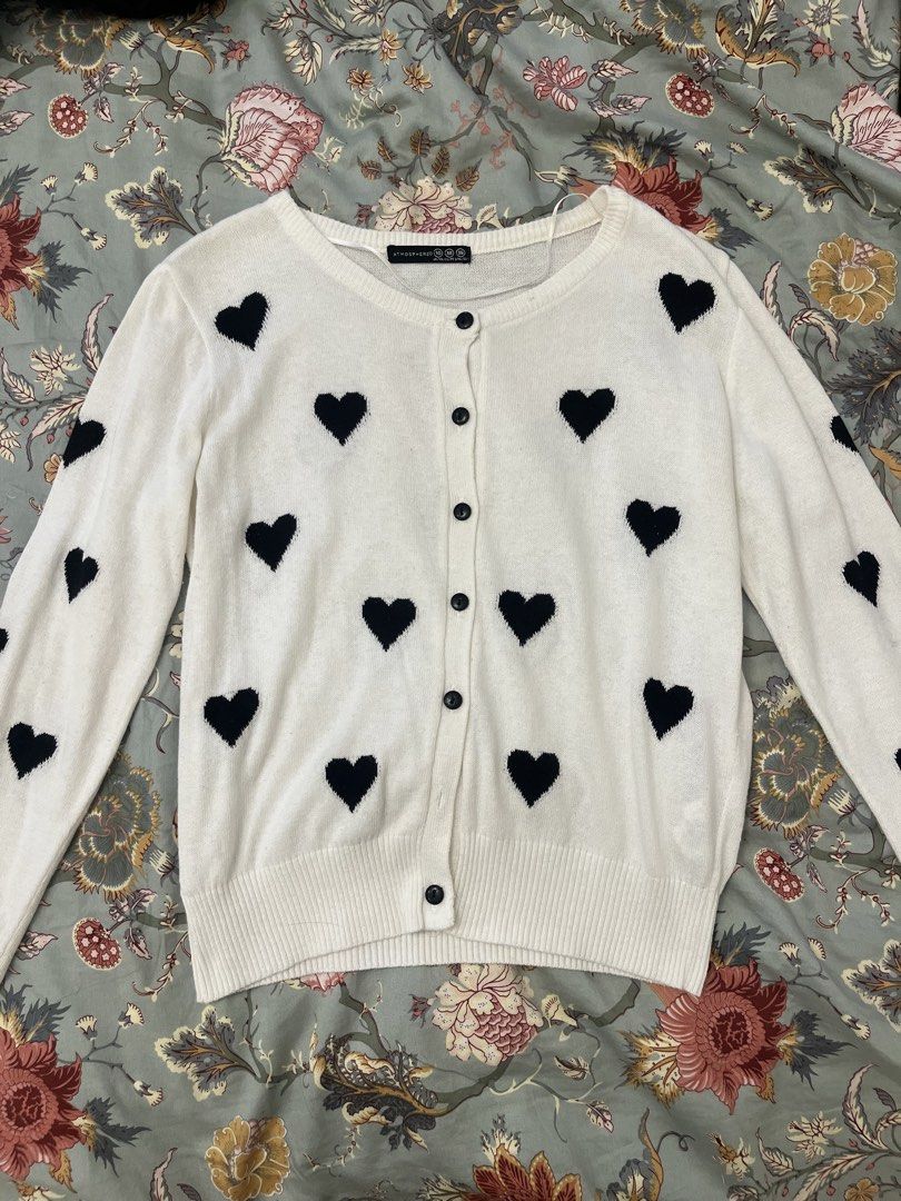 Atmosphere Heart Print Cardigan (Category: Coats, Jackets and Outerwear) located in Quezon City. Submitted by matchaprincess33 (Listing ID 1422319793, Image 1). Description: - White cardigan with black heart print - Button-down closure - Long sleeves - Brand: Atmosphere - Size: 10 (UK) / 36 (EUR) / 36 (USA).