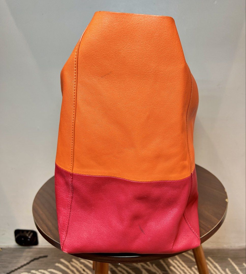 AUTH 💯 CELINE HORIZONTAL BI-CABAS LARGE TOTE (Category: Luxury Bags & Wallets) located in Manila. Submitted by zipandgoo (Listing ID 1422359341, Image 3). Description: 𝙲𝙴𝙻𝙸𝙽𝙴 𝙷𝙾𝚁𝙸𝚉𝙾𝙽𝚃𝙰𝙻 𝙱𝙸-𝙲𝙰𝙱𝙰𝚂 𝙻𝙰𝚁𝙶𝙴 𝚃𝙾𝚃𝙴 𝙱𝙰𝙶 ♡ AUTHENTIC 💯 - Two-tone design: Orange and Red - Large size, perfect for everyday use - Crafted from high-quality leather - Interior features a zip pocket for secure storage Please message me for more p