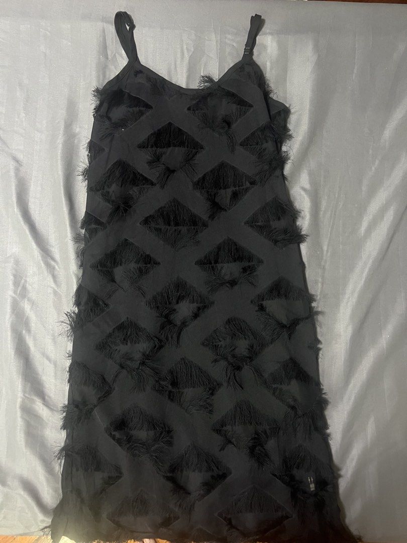 Black Fringed Feather Dress (Category: Dresses) located in Quezon City. Submitted by chloe_declutter (Listing ID 1422258018, Image 1). Description: - Black dress with fringed diamond pattern - Adjustable spaghetti straps - Approximately 42 inches long - Bust measures approximately 18 inches across - Perfect for special occasions Still available 06/26 Clear box Location Cubao QC can ship through J&T.