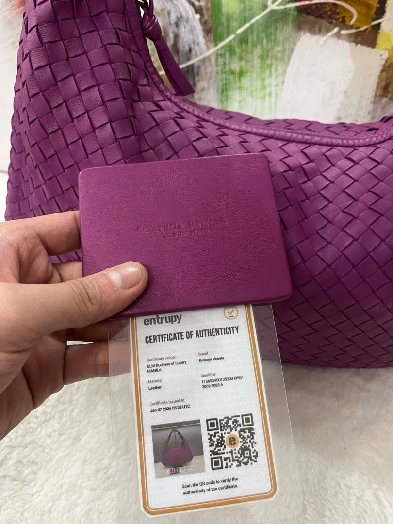 Bottega Veneta Hobo Bag (Category: Luxury Bags & Wallets) located in Paranaque City. Submitted by glenjonluxuryfinds2 (Listing ID 1422341420, Image 3). Description: - Authentic Bottega Veneta hobo bag - Stunning purple color - Signature woven design - Includes matching card holder - Comes with certificate of authenticity - Interior zippered pocket - Made in Italy.
