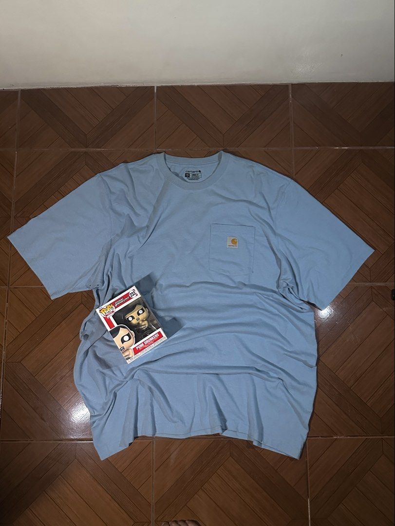 Carhartt Pocket Tee - 2XL Tall (Category: Tshirts & Polo Shirts ) located in Makati City. Submitted by rainner_31 (Listing ID 1422245948, Image 1). Description: - Carhartt pocket tee - Light blue color - Features chest pocket with Carhartt logo - Size: 2XL Tall - Material: Cotton/Polyester blend - Fit: Loose - Neckline: Crew - Sleeves: Short - Season: Fall 2022 CARHARTT COLOR RATE: 9.8/10 Excellent Condition DIMES: W- 28 L- 37 SIZE 2XL .