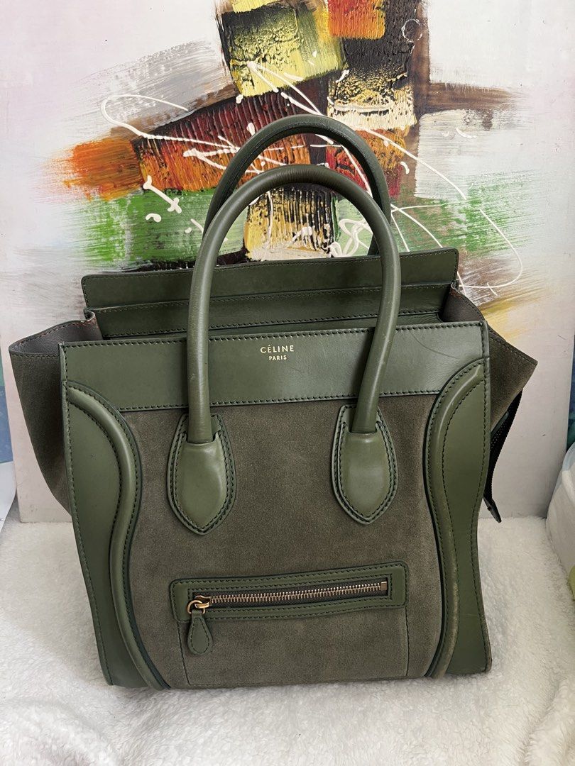 Celine Luggage Handbag Olive Green (Category: Luxury Bags & Wallets) located in Paranaque City. Submitted by glenjonluxuryfinds2 (Listing ID 1422366995, Image 1). Description: - Authentic Celine Luggage handbag - Color: Olive Green - Exterior: Suede and leather - Closure: Zip - Handles: Double - Interior: Zip pocket - Hardware: Gold-toned - Features Celine Paris logo - Condition: Shows wear on handles and corners.