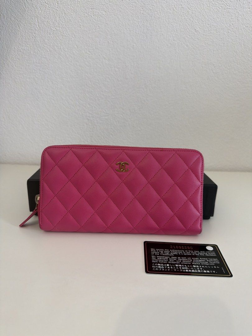 Chanel Quilted Zip Around Wallet (Category: Luxury Bags & Wallets) located in Manila. Submitted by justabagxoxo (Listing ID 1422270836, Image 1). Description: - Authentic Chanel wallet - Vibrant pink color - Quilted design with Chanel logo - Includes original box and authenticity card - Multiple compartments for cards and cash - Made in Spain.