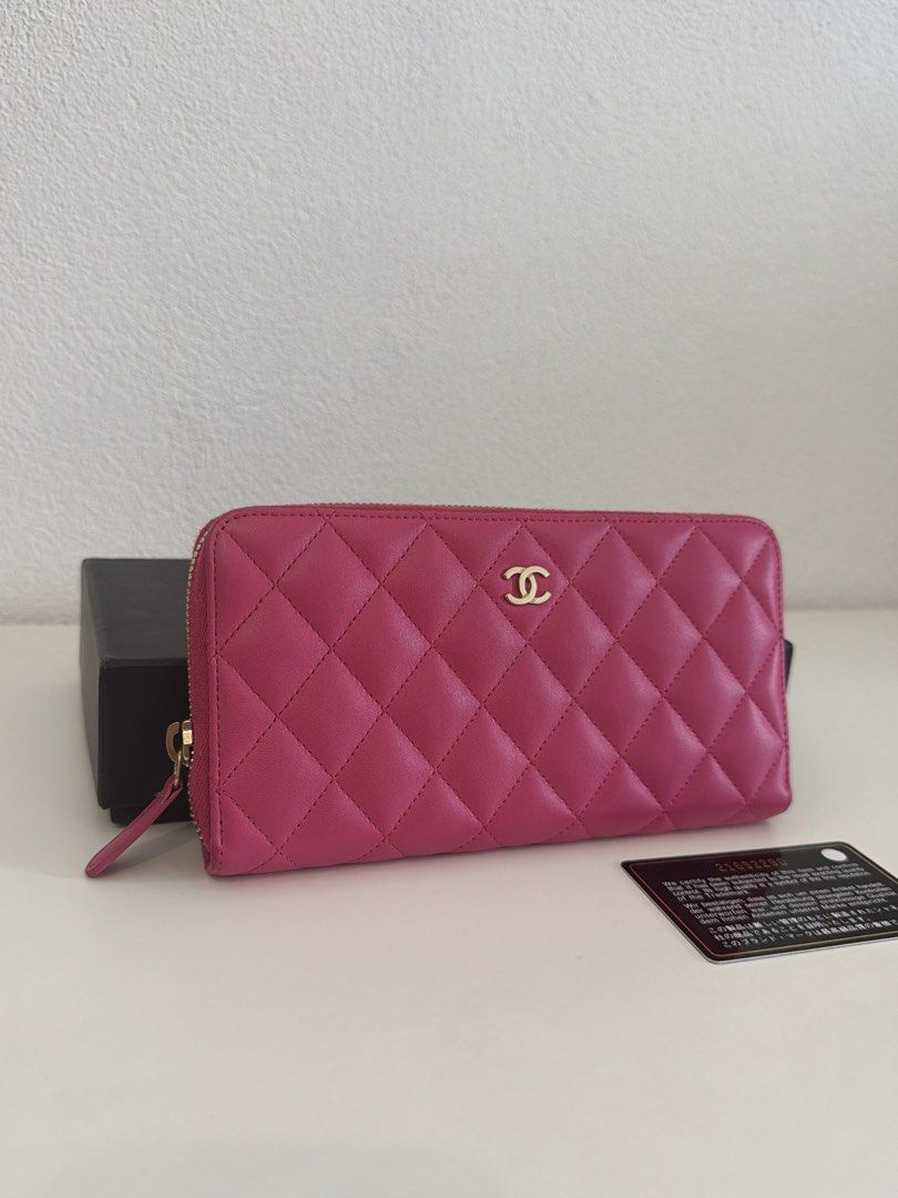 Chanel Quilted Zip Around Wallet (Category: Luxury Bags & Wallets) located in Manila. Submitted by justabagxoxo (Listing ID 1422270836, Image 2). Description: - Authentic Chanel wallet - Vibrant pink color - Quilted design with Chanel logo - Includes original box and authenticity card - Multiple compartments for cards and cash - Made in Spain.
