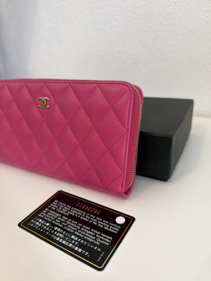Chanel Quilted Zip Around Wallet (Category: Luxury Bags & Wallets) located in Manila. Submitted by justabagxoxo (Listing ID 1422270836, Image 3). Description: - Authentic Chanel wallet - Vibrant pink color - Quilted design with Chanel logo - Includes original box and authenticity card - Multiple compartments for cards and cash - Made in Spain.