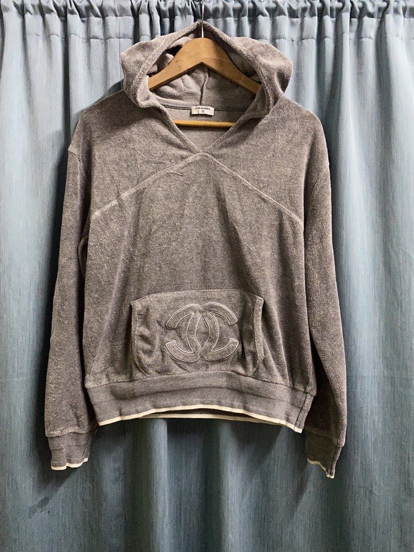 Chanel Terry Cloth Hoodie (Category: Luxury Apparel) located in Dagupan City. Submitted by junkfiles. (Listing ID 1422385515, Image 1). Description: - Chanel gray terry cloth hoodie - Features a large Chanel logo on the front pocket - V-neck design - Hooded - White trim on cuffs and hem - Chanel logo on inside tag.