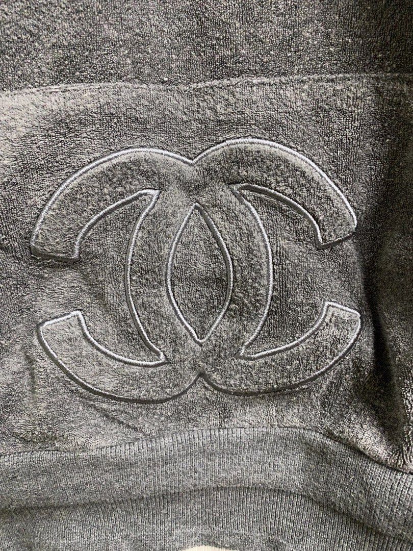 Chanel Terry Cloth Hoodie (Category: Luxury Apparel) located in Dagupan City. Submitted by junkfiles. (Listing ID 1422385515, Image 3). Description: - Chanel gray terry cloth hoodie - Features a large Chanel logo on the front pocket - V-neck design - Hooded - White trim on cuffs and hem - Chanel logo on inside tag.