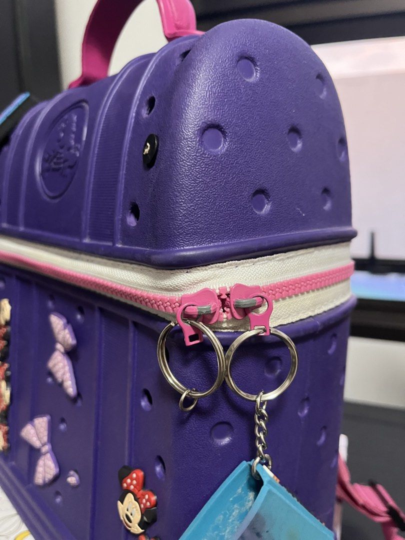 Crocs Purple Backpack with jibitz Minnie Mouse Charms (Category: Diaper Bags & Wetbags) located in Quezon City. Submitted by samirosie0329 (Listing ID 1422357137, Image 2). Description: Original Crocs bag Pls see attached photo for the issues :) .