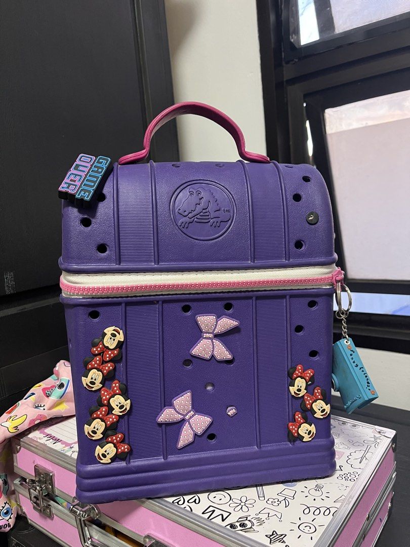 Crocs Purple Backpack with jibitz Minnie Mouse Charms (Category: Diaper Bags & Wetbags) located in Quezon City. Submitted by samirosie0329 (Listing ID 1422357137, Image 1). Description: Original Crocs bag Pls see attached photo for the issues :) .