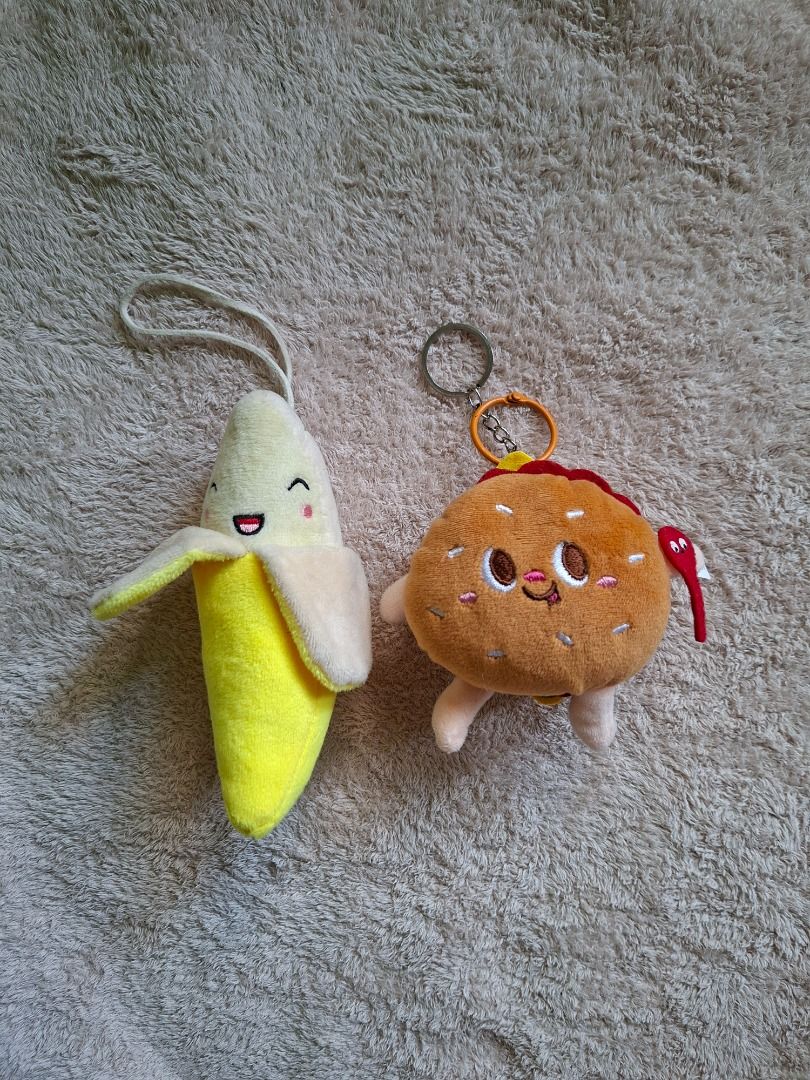 Cute Plushie Keychains - Banana and Burger (Category: Plushies & Soft Toys) located in San Jose. Submitted by imryurs (Listing ID 1407818112, Image 2). Description: Disclaimer: Actual color may vary due to lighting or your screen. Food Keychains (Assorted) 80 php • Flaws: - dirt/dust (washable). - From personal collection. Both used. • 2 pieces. Selling as bundle only. • RFS: Decluttering MOP: Gcash MOD: Direct J&T/ LBC Starting price of shipping