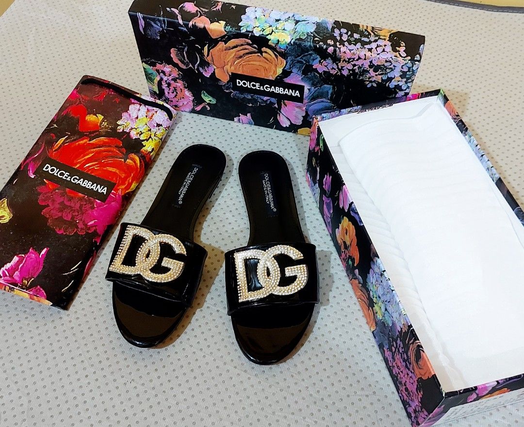 Dolce & Gabbana DG Embellished Sandals (Category: Flats & Sandals) located in La Trinidad. Submitted by marksols (Listing ID 1422243668, Image 2). Description: - Dolce & Gabbana sandals - Features iconic crystal-embellished DG logo - Black patent leather finish - Size 37 - Includes original box and dust bag - Made in Italy.