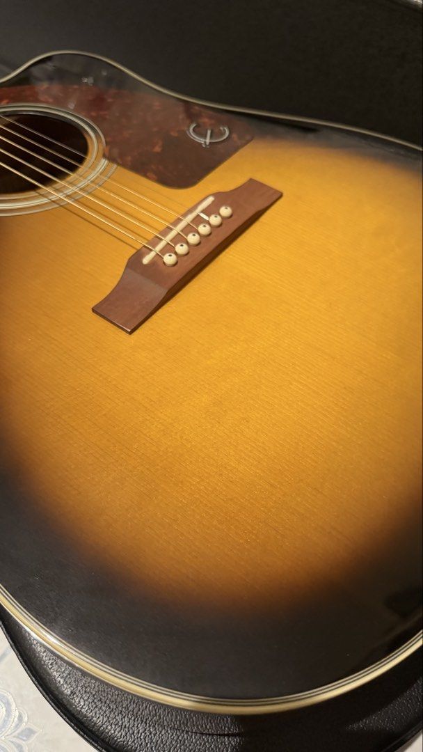 Epiphone J-15 EV Deluxe w/ Hardcase (Category: Musical Instruments) located in Quezon City. Submitted by msetcetera (Listing ID 1422241434, Image 3). Description: Epiphone J-15 EV Deluxe w/ Hardcase Specifications: Top Material: Spruce Body Material: Mahogany. Preamp System: Fishman’s Presys II Onboard Neck Material: Okoume Neck Shape: Slim Taper; D-Profile Neck Joint: Glued-In, Set Neck Scale Length: 25.5” Headstock: Sloped Dovetail Headstock In
