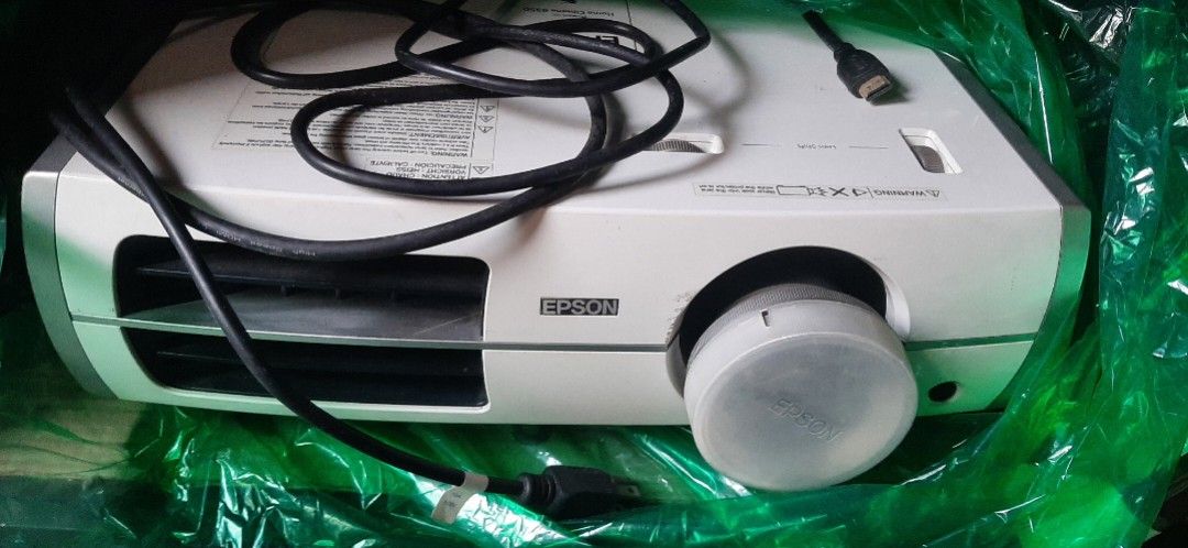 Epson Home Cinema 8350 Projector (Category: Projectors) located in Las Pinas. Submitted by 030700 (Listing ID 1422272752, Image 1). Description: - Epson Home Cinema 8350 projector - Includes power cable - Features lens adjustment dial - White unit - Epson logo visible - Model number clearly printed - Manual and remote control !!! Relocating/Moving Soon !!! Most items posted have been stored for a decade or longer hence the discoloration or stain 