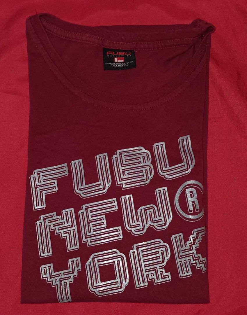 FUBU New York T-shirt - Medium (Category: Tshirts & Polo Shirts ) located in Manila. Submitted by 3Nel5 (Listing ID 1422352191, Image 1). Description: - FUBU New York T-shirt - Color: Maroon - Size: Medium - Features the FUBU logo in silver (outlined) - Crew neck and short sleeves - Plain maroon back - Made of soft material - Ideal for casual wear.