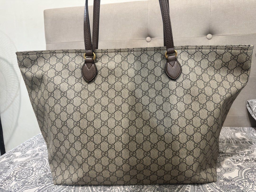 Gucci GG Supreme Canvas Tote Bag (Category: Luxury Bags & Wallets) located in Muntinlupa City. Submitted by skapdesign (Listing ID 1422304765, Image 2). Description: - Authentic Gucci tote bag - Crafted from GG Supreme canvas - Features brown leather handles and trim - Light-colored interior lining - Includes certificate of authenticity from Entrupy - Spacious interior, perfect for everyday use.