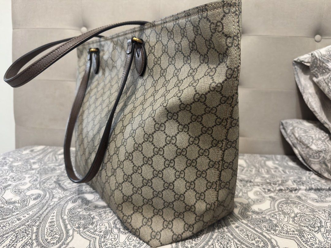 Gucci GG Supreme Canvas Tote Bag (Category: Luxury Bags & Wallets) located in Muntinlupa City. Submitted by skapdesign (Listing ID 1422304765, Image 3). Description: - Authentic Gucci tote bag - Crafted from GG Supreme canvas - Features brown leather handles and trim - Light-colored interior lining - Includes certificate of authenticity from Entrupy - Spacious interior, perfect for everyday use.