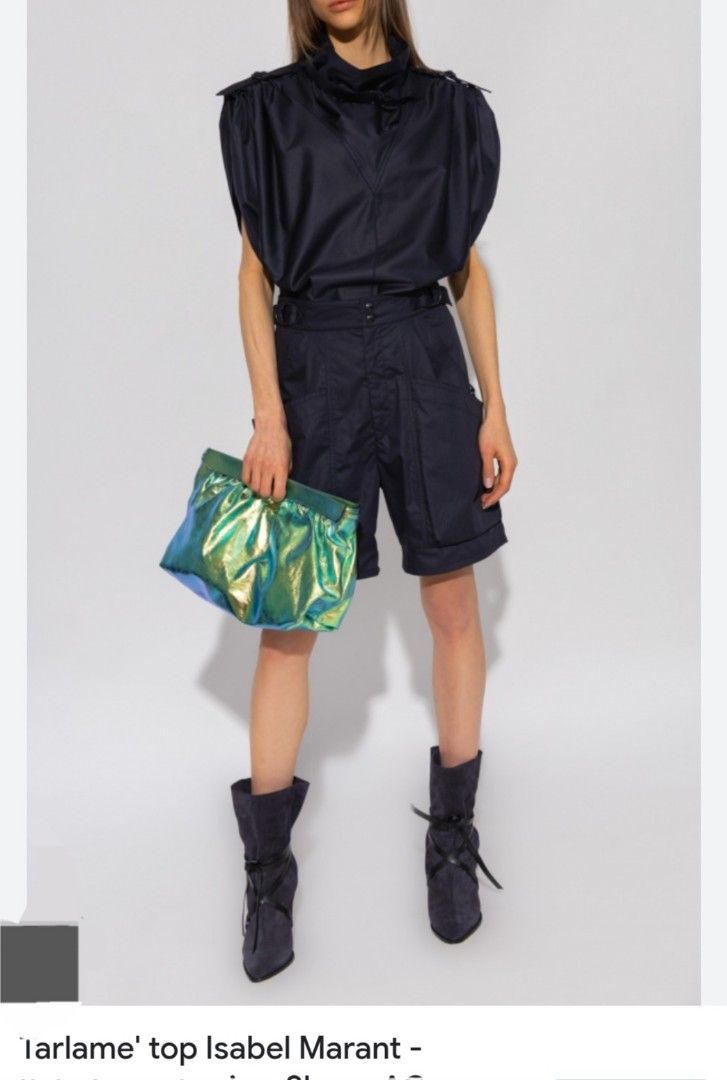 Isabel Marant Tarlame Top Size 36 (Category: Shirts) located in Manila. Submitted by msaludo (Listing ID 1422247518, Image 1). Description: - Isabel Marant Tarlame top - Color: Navy blue - Size: 36 - Fabric: 100% cotton - Made in Romania - Features a collared neckline and short sleeves - Unique, slightly draped design - Includes care instructions excellent condition .