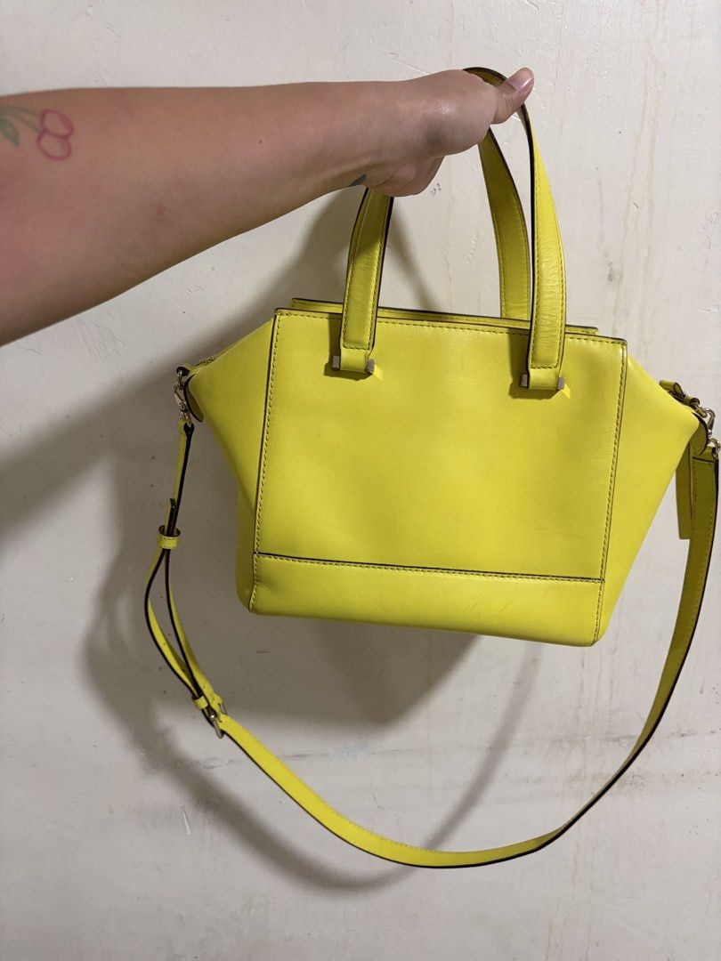 Kate Spade New York Bow Satchel (Category: Luxury Bags & Wallets) located in Manila. Submitted by dmmai (Listing ID 1422354627, Image 2). Description: - Bright yellow Kate Spade satchel - Bow detail on the front - Top handle and detachable shoulder strap - Polka dot lining - Silver hardware - Zipper closure - Protective metal feet Flaws as in the pictures, very minor, overall still a great bag.