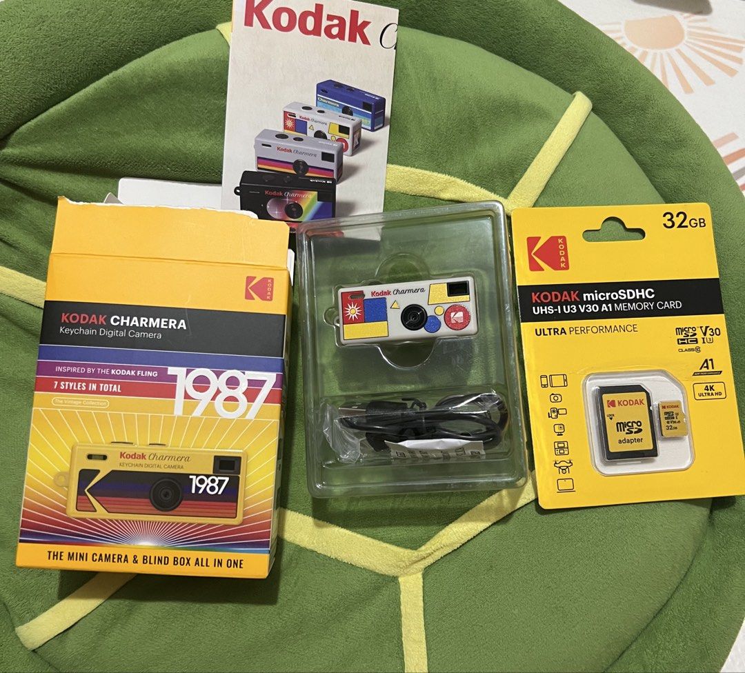 Kodak Charmera Keychain Digital Camera 1987 (Category: Cameras) located in San Fernando. Submitted by declutterwithj (Listing ID 1422324647, Image 2). Description: Opened but not used - Vintage Kodak Charmera Keychain Camera (1987) - White body with colorful accents - Includes: - Camera - 32GB microSDHC Memory Card & Adapter - Charging Cable - Mini camera and blind box design.