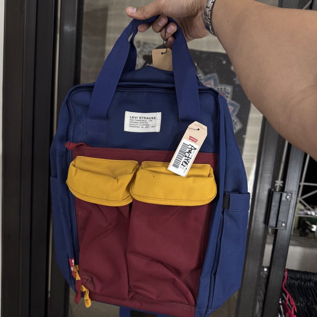 Levi's multicolor backpack with laptop compartment (Category: Backpacks) located in Manila. Submitted by aries.15 (Listing ID 1422371899, Image 2). Description: Levis multi pocket backpack w/ laptop compartment 💕 -brandnew -18 inches height by 16 width -no issue -some part has dirt need wash 2499 only 🌸 .